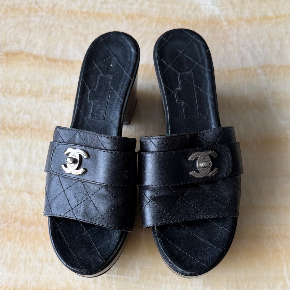 Chanel Black Quilted Mules with Silver Logo